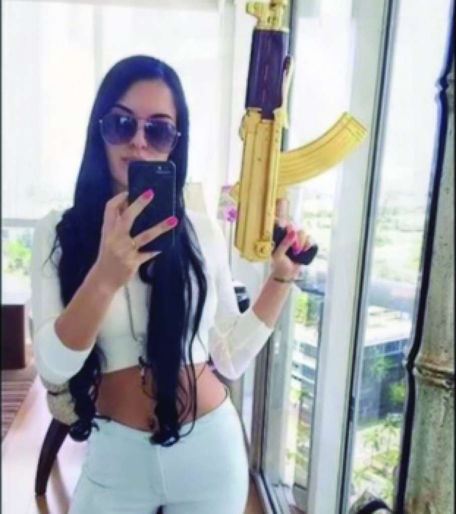  An unnamed gang member poses with a weapon